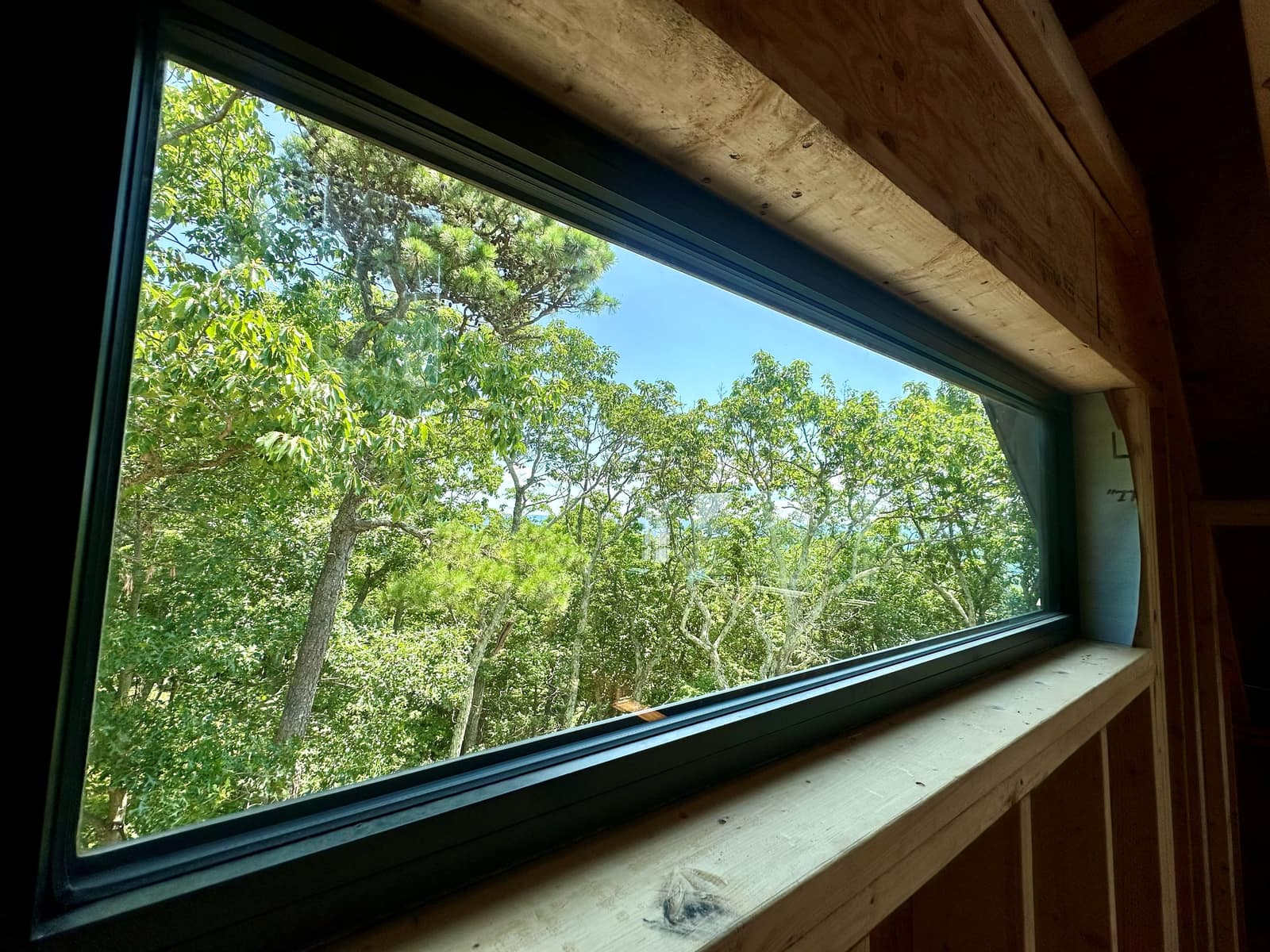 Sloped trapezoid unit under the rafters, cut to the roof angle.