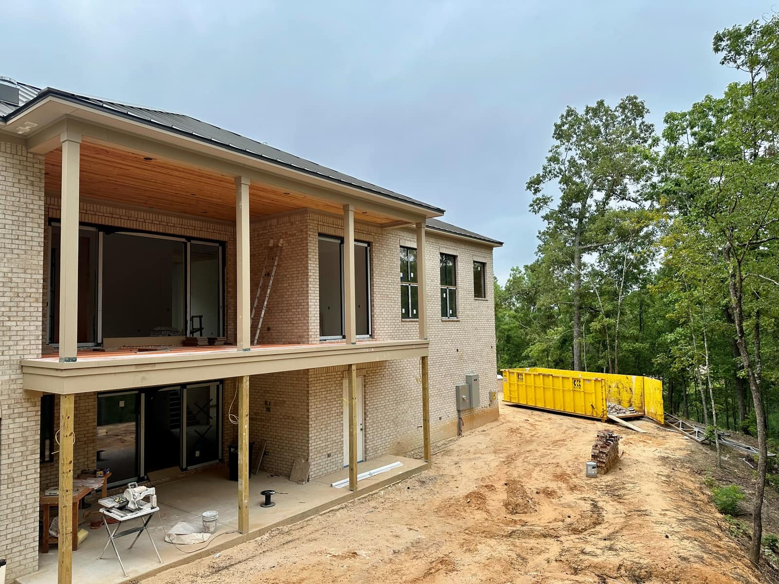 Rear elevation with the full aluminum package installed, ahead of exterior finishes.