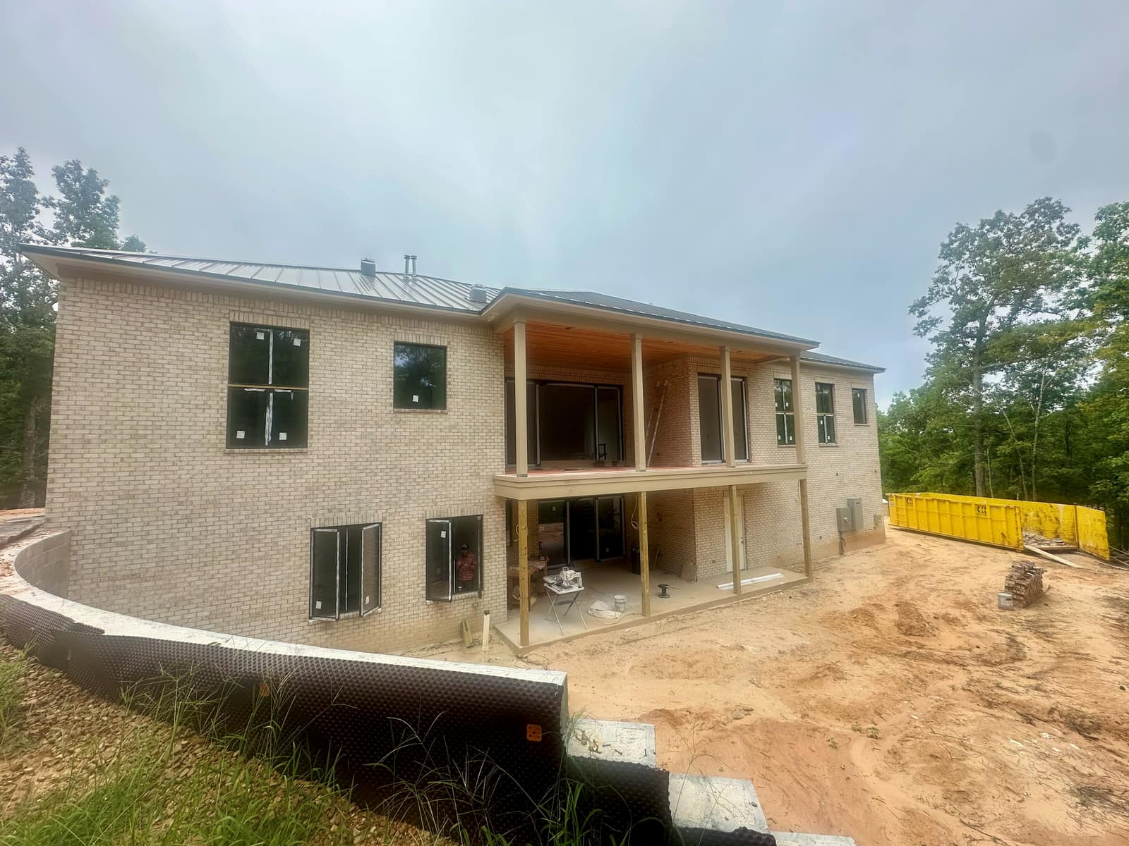 Side elevation - punched openings across both floors, all units glazed and sealed.