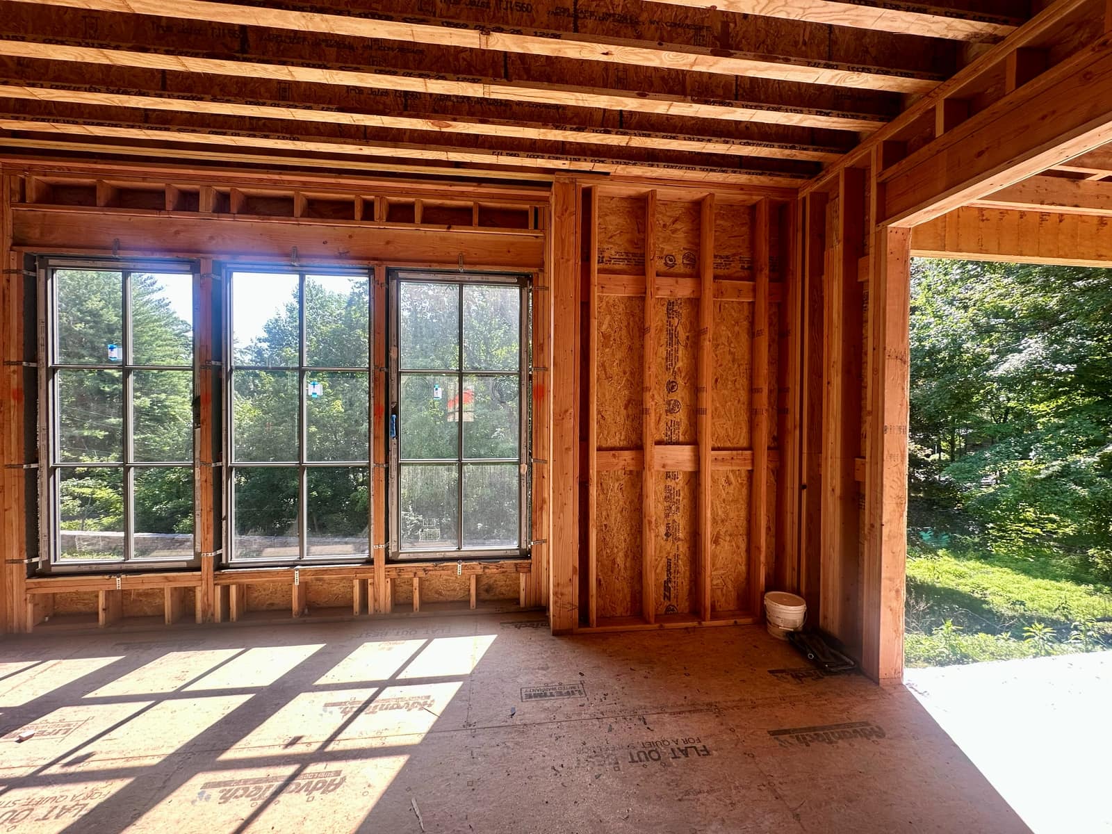 Living space with a three-part unit and fixed sidelights.