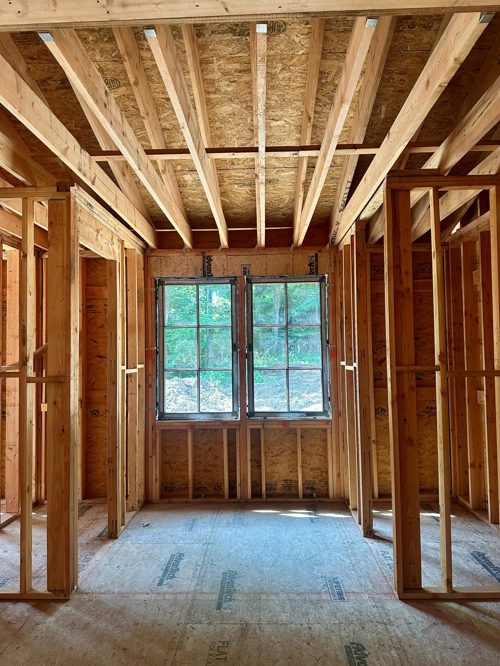 Paired SDL units in the rear wall, set above a framed sill.