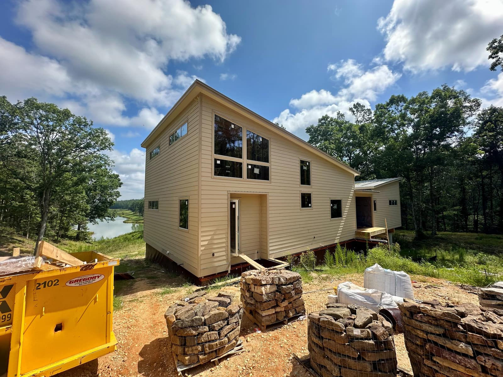 The house from the lake side, glazing installed ahead of siding and trim.