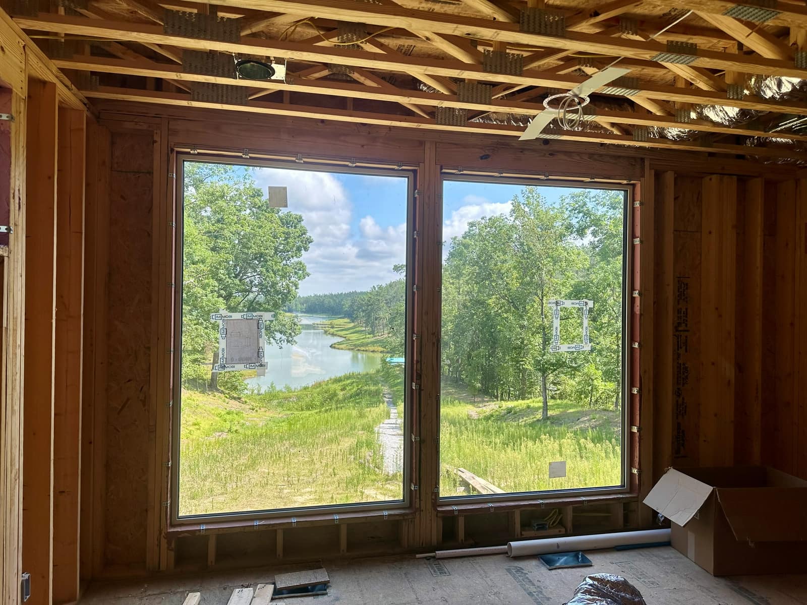Corner of the living space - two large fixed units framing the water.