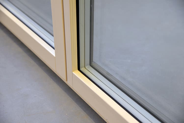 Detail of a Synergic aluminum-clad wood window showing the timber sash and the aluminum shell