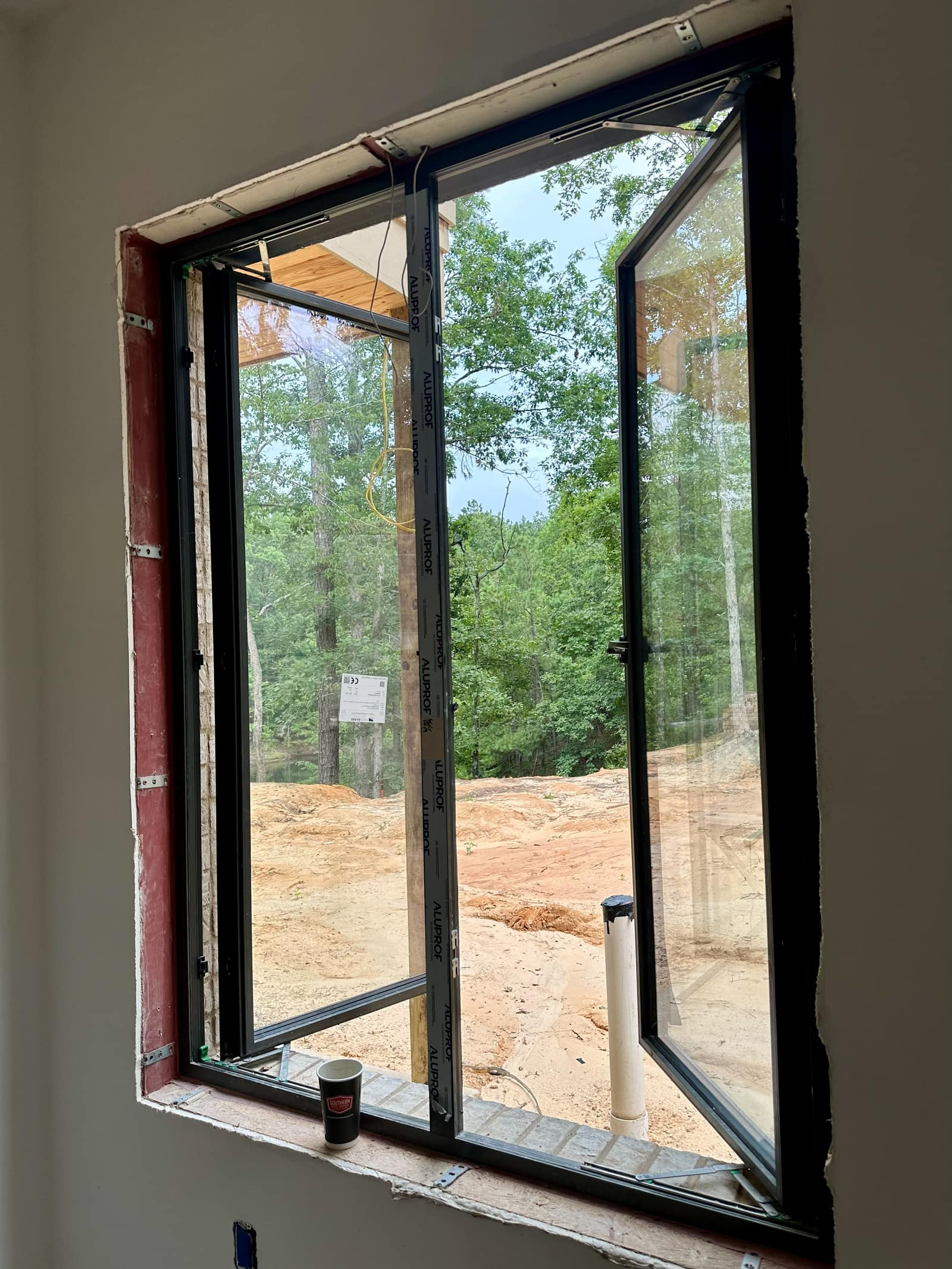 European aluminum window sash swung inward on a custom home in Oxford, Mississippi