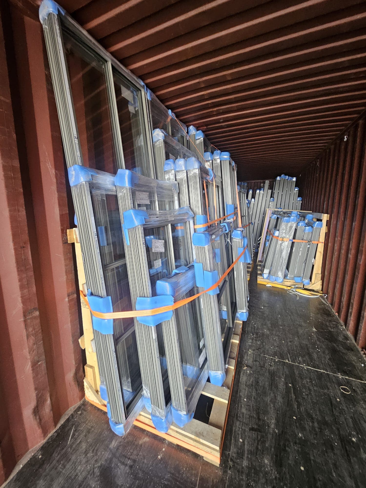 Palletized European windows loaded in a shipping container for a US project